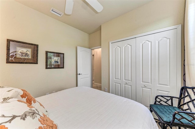 bedroom with ceiling fan and a closet