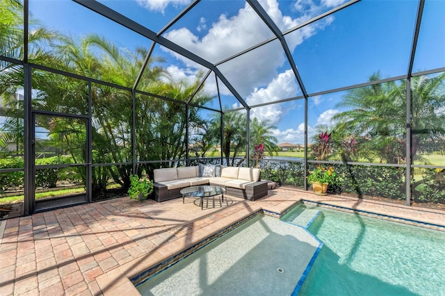 view of pool featuring a lanai, a patio area, and outdoor lounge area