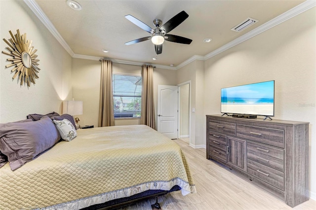 bedroom featuring ceiling fan, light hardwood / wood-style flooring, and ornamental molding