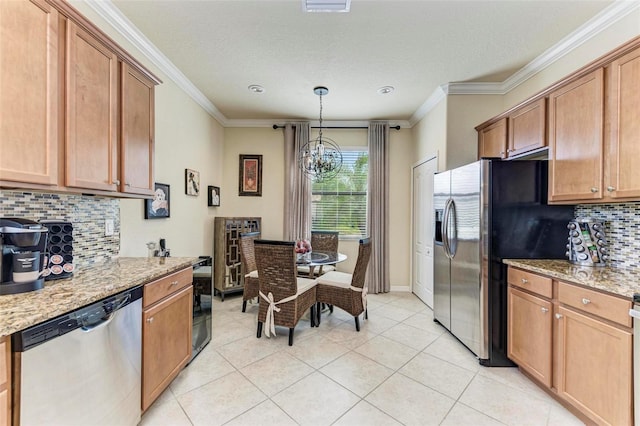 kitchen featuring stainless steel appliances, an inviting chandelier, tasteful backsplash, light stone countertops, and pendant lighting