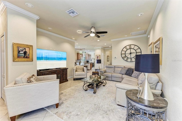 tiled living room featuring ceiling fan and crown molding