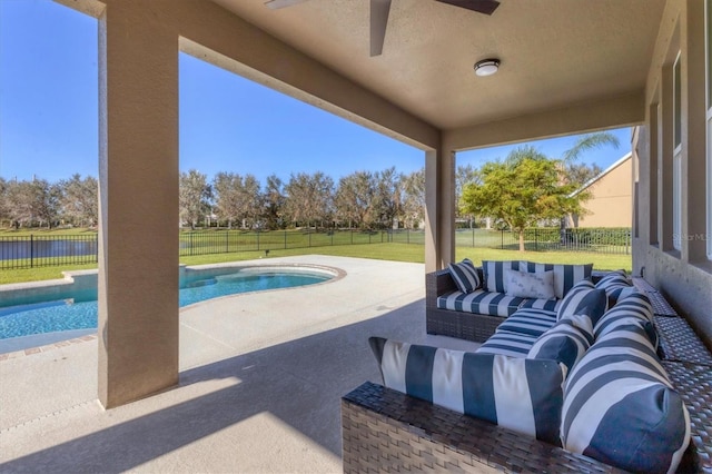 view of pool with a patio, outdoor lounge area, a lawn, and a water view