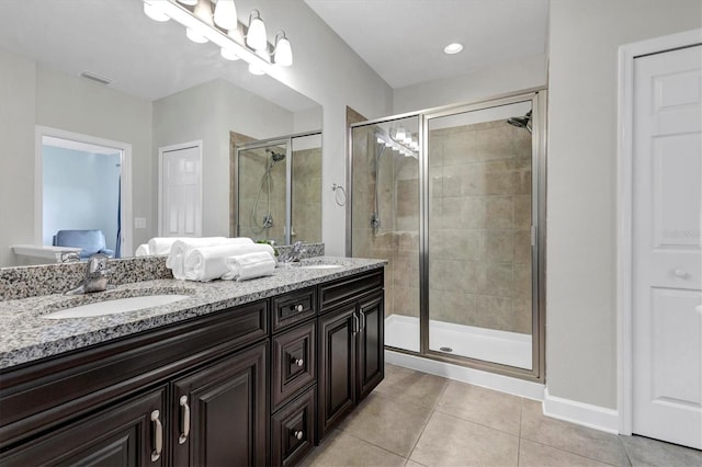 bathroom with vanity, tile patterned flooring, and an enclosed shower