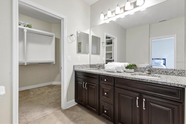 bathroom with vanity and tile patterned floors