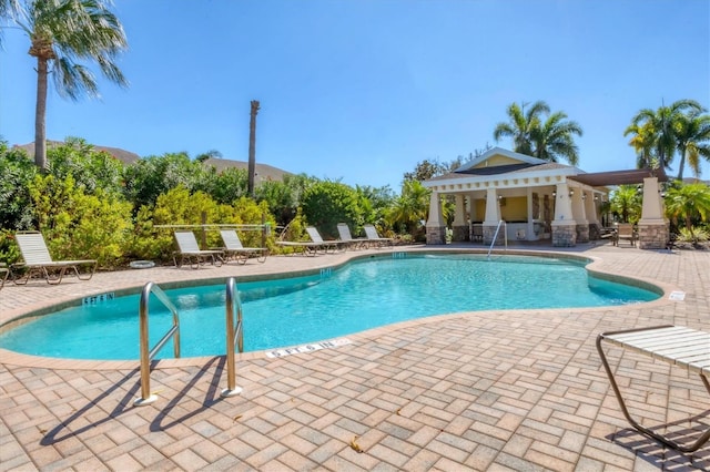 view of swimming pool featuring a gazebo and a patio