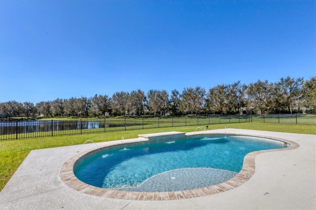 view of pool with pool water feature, a yard, and a water view