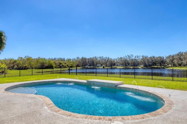 view of pool featuring pool water feature, a water view, and a lawn