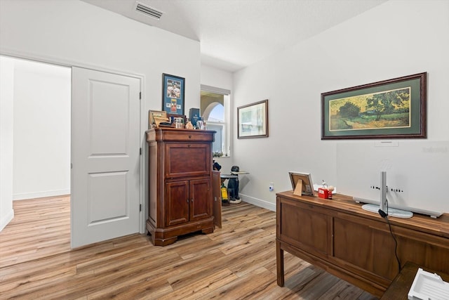 office area with light hardwood / wood-style floors