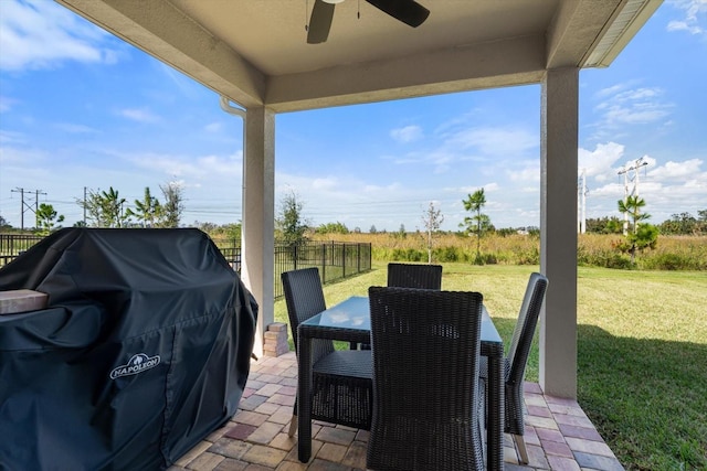 view of patio with area for grilling and ceiling fan