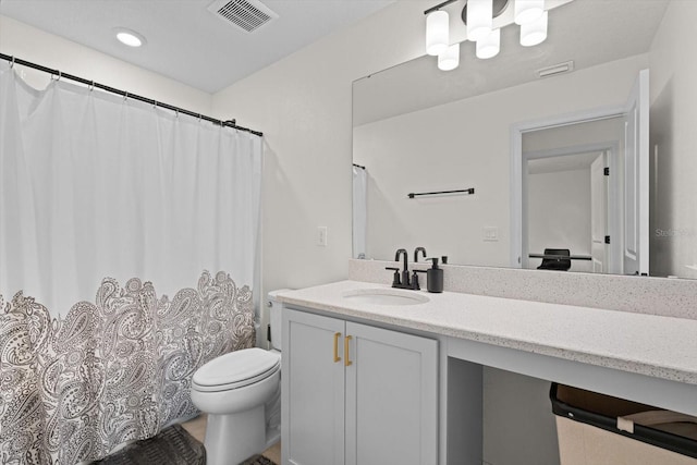 bathroom featuring vanity, curtained shower, and toilet