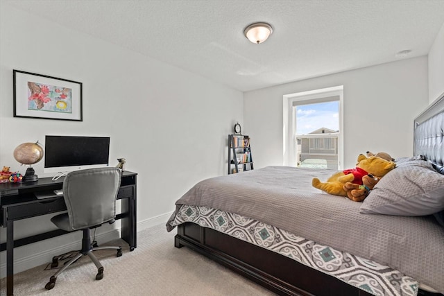 carpeted bedroom with a textured ceiling