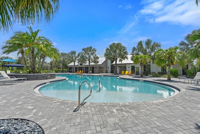 view of swimming pool with a patio