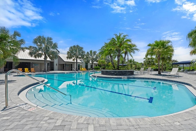 view of swimming pool with a patio