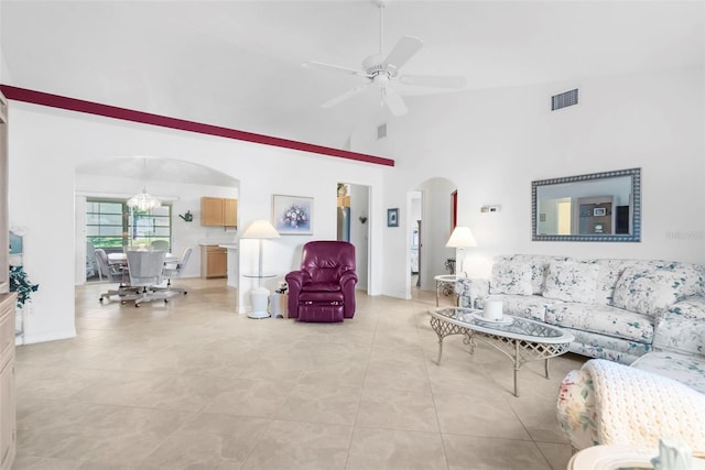 living room with ceiling fan, high vaulted ceiling, and light tile patterned flooring