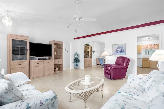 living room featuring ceiling fan, light tile patterned flooring, and lofted ceiling