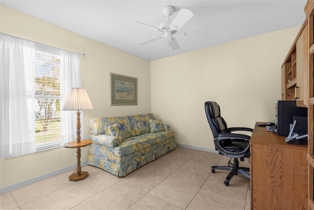 tiled office with a healthy amount of sunlight and ceiling fan