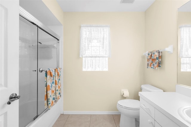 full bathroom with toilet, combined bath / shower with glass door, vanity, and tile patterned flooring