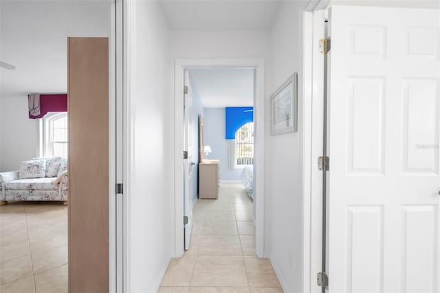 corridor featuring light tile patterned flooring