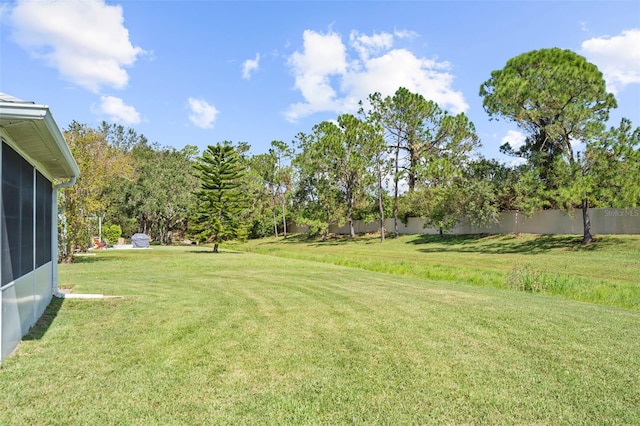 view of yard featuring a sunroom