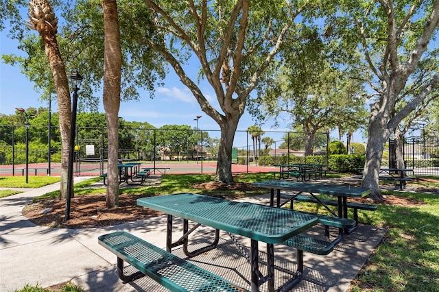 view of property's community with tennis court