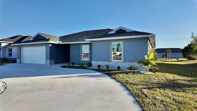 single story home featuring a garage and a front lawn