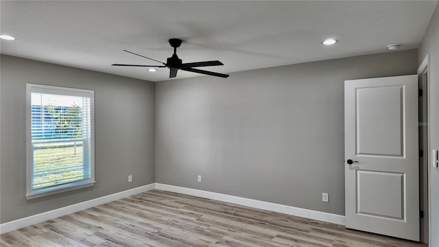 spare room featuring ceiling fan and light hardwood / wood-style floors