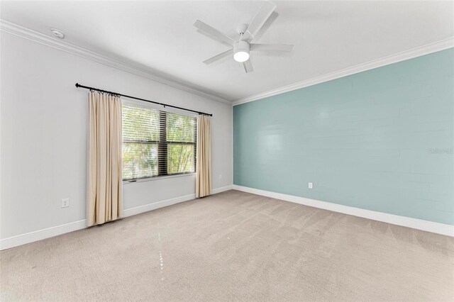 1269 Backspin Dr, Englewood, FL 34223 - empty room featuring baseboards, ornamental molding, ceiling fan, and light carpet