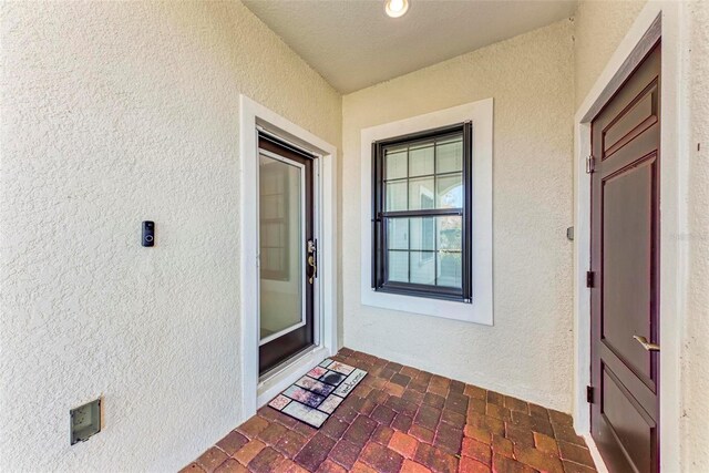1269 Backspin Dr, Englewood, FL 34223 - doorway to property with stucco siding