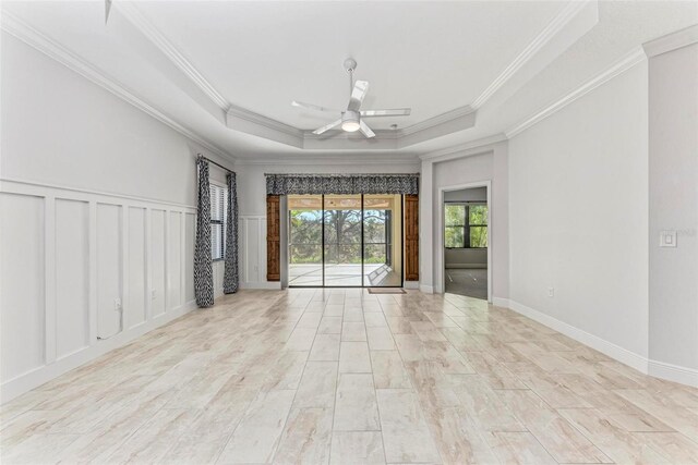1269 Backspin Dr, Englewood, FL 34223 - unfurnished room featuring ornamental molding, ceiling fan, and a tray ceiling