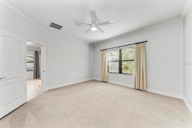 1269 Backspin Dr, Englewood, FL 34223 - unfurnished room with crown molding, visible vents, ceiling fan, baseboards, and light carpet