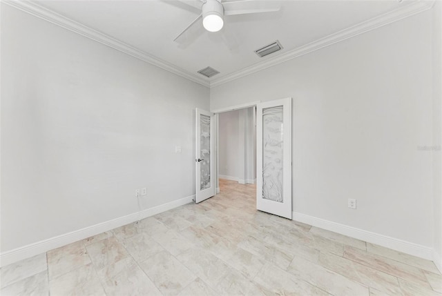 1269 Backspin Dr, Englewood, FL 34223 - spare room with crown molding, a ceiling fan, visible vents, and baseboards