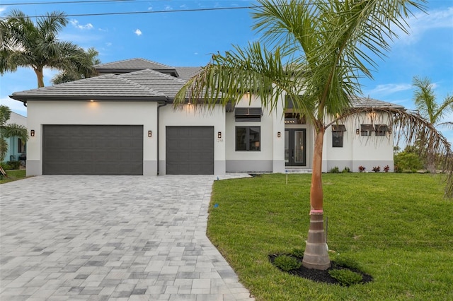 view of front facade with a front yard and a garage