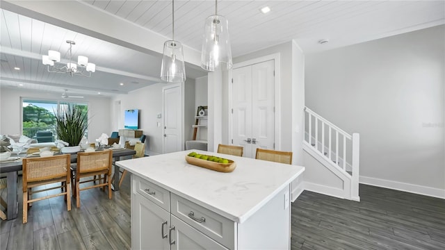 kitchen featuring a kitchen island, wooden ceiling, pendant lighting, and dark hardwood / wood-style floors