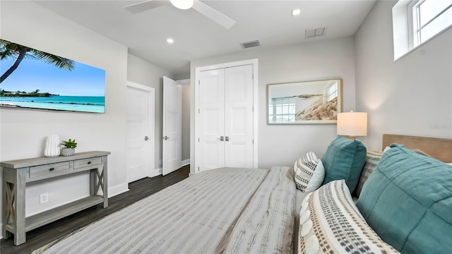 bedroom featuring a closet, ceiling fan, and dark hardwood / wood-style floors