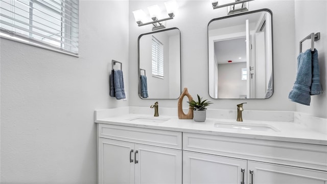 bathroom with vanity and plenty of natural light