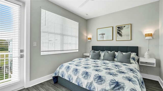 bedroom featuring wood-type flooring, multiple windows, and ceiling fan