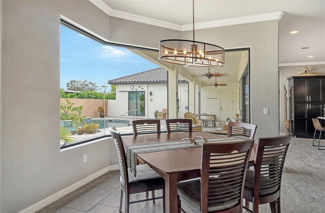 dining area with crown molding and ceiling fan with notable chandelier