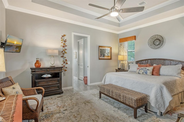 bedroom featuring a raised ceiling, ornamental molding, and ceiling fan