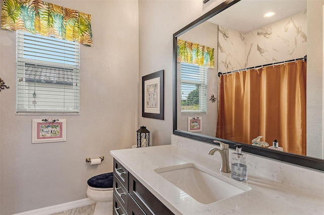 bathroom with vanity, toilet, and a shower with shower curtain