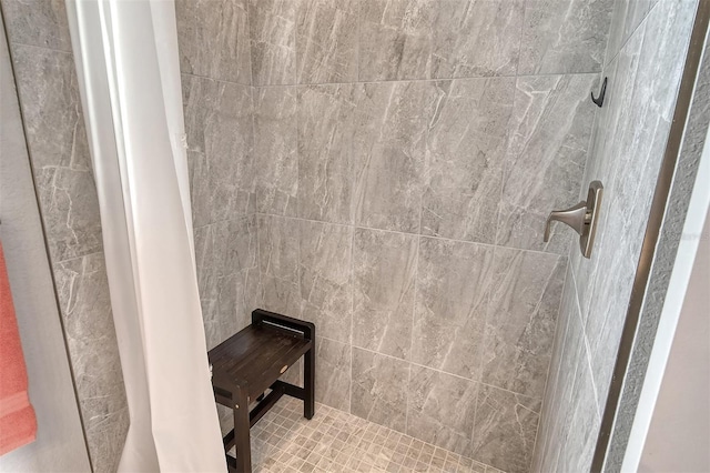 bathroom with tiled shower