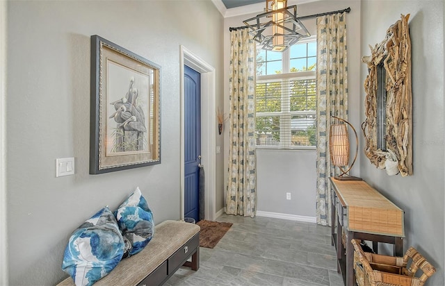 entryway featuring ornamental molding