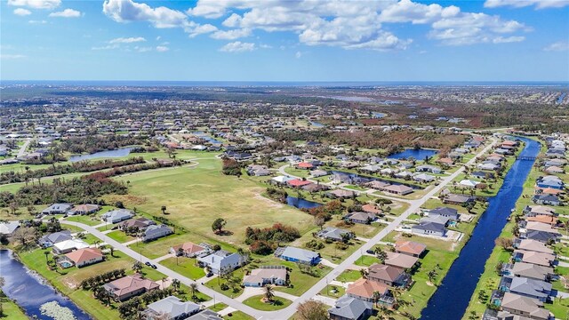 aerial view featuring a water view and a residential view