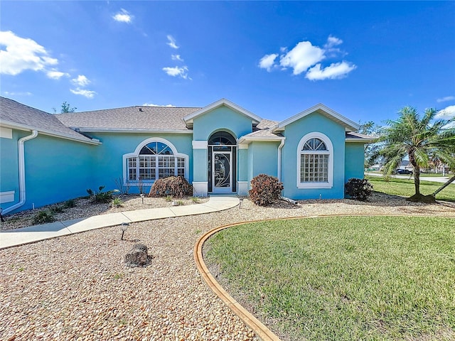 ranch-style home with a front yard