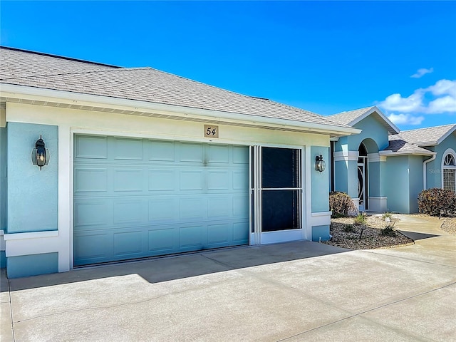 single story home with a garage