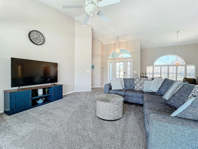 living room with ceiling fan, high vaulted ceiling, french doors, carpet, and baseboards