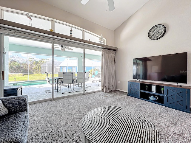 living room with ceiling fan, carpet, and lofted ceiling