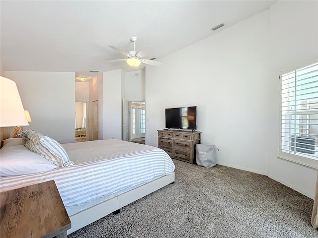 bedroom featuring carpet floors, ceiling fan, vaulted ceiling, and visible vents