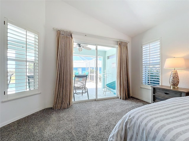 carpeted bedroom featuring access to exterior, vaulted ceiling, and multiple windows