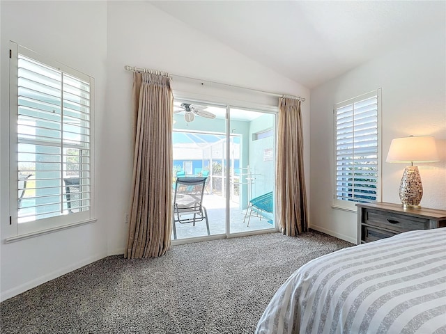 carpeted bedroom with baseboards, vaulted ceiling, multiple windows, and access to exterior