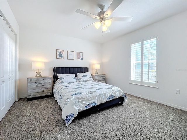 bedroom with a closet, ceiling fan, and dark colored carpet